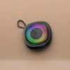 Black portable speaker with a colorful ring-shaped light effect on the front and Bluetooth wireless mini speaker Application Scenario